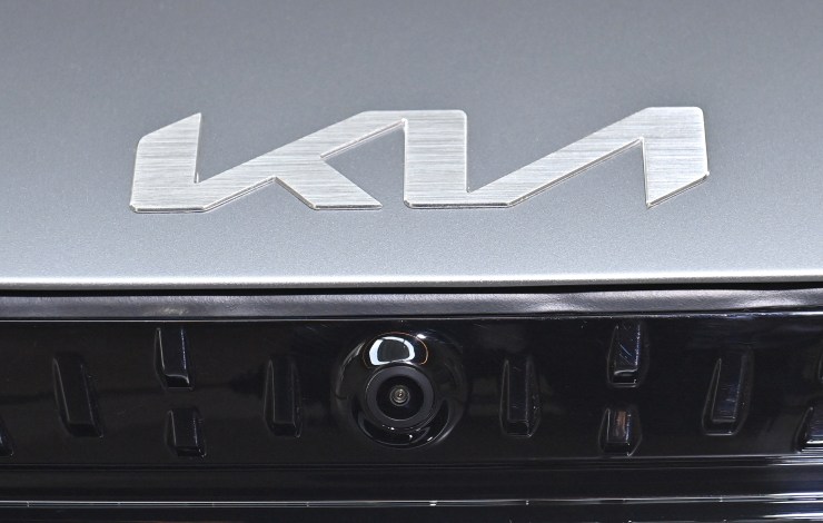 This picture taken on June 1, 2021 shows the new Kia logo on one of its all-electric vehicles.