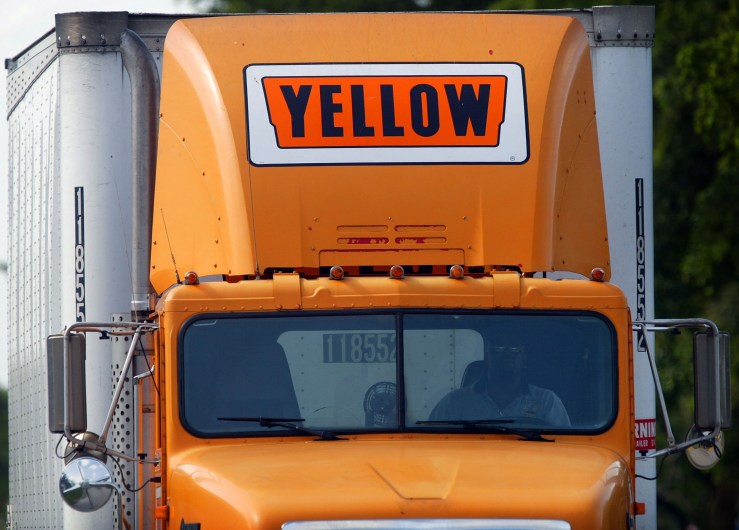 A conspicuously orange Yellow Roadway Corp., truck sign is seen atop a truck in Miami, Florida in July, 2003