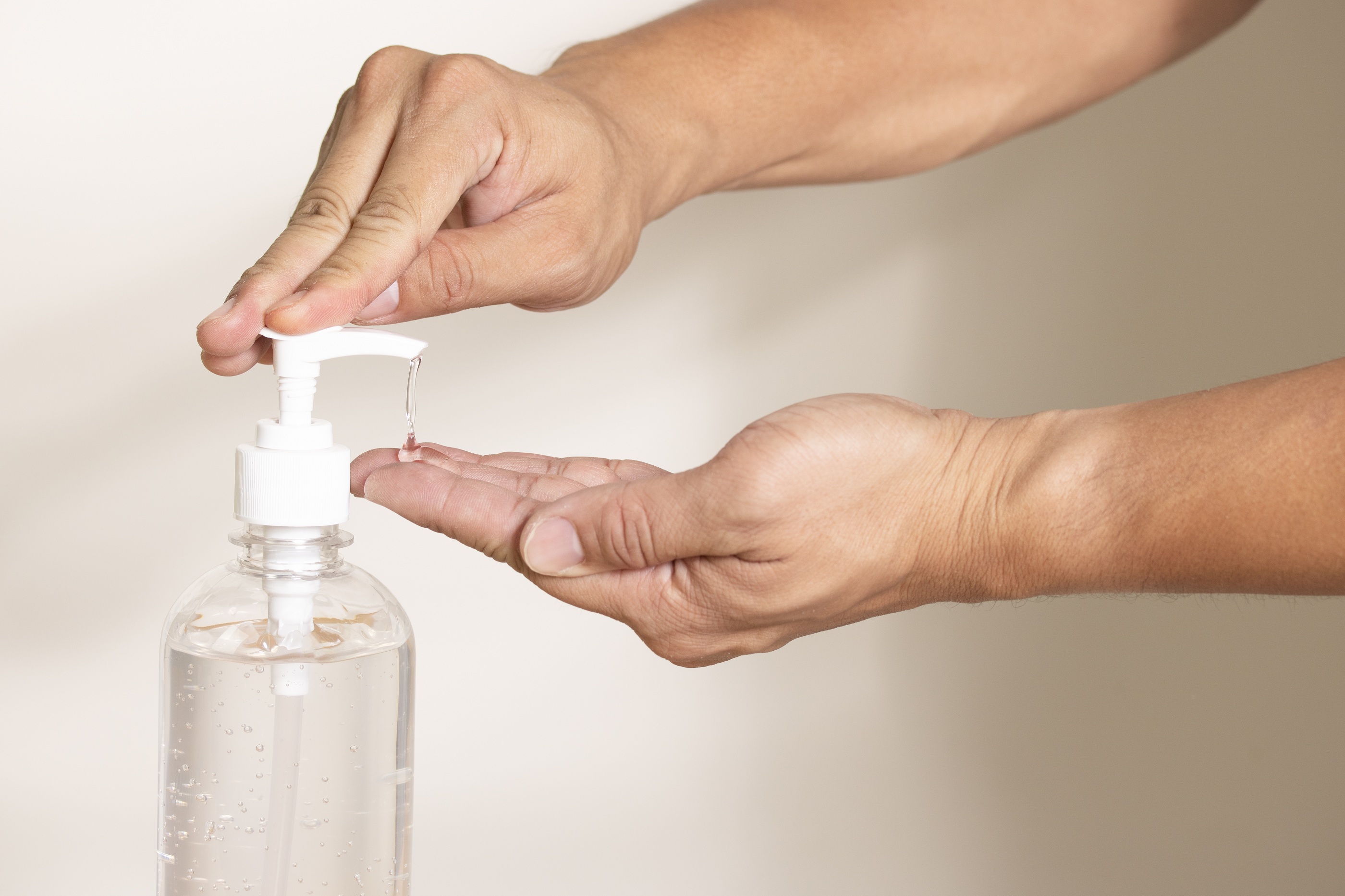  A person uses a hand sanitizer with 60 percent alcohol to clean their hands.
