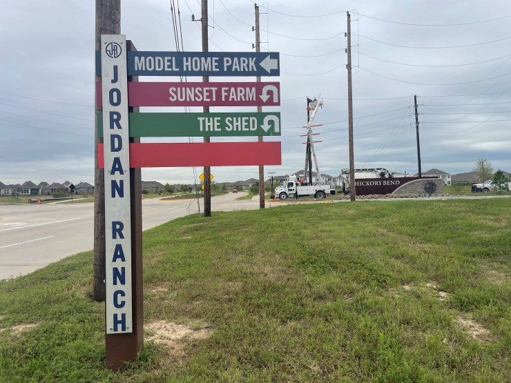 Signs that say Jordan Ranch and give directions to various locations.