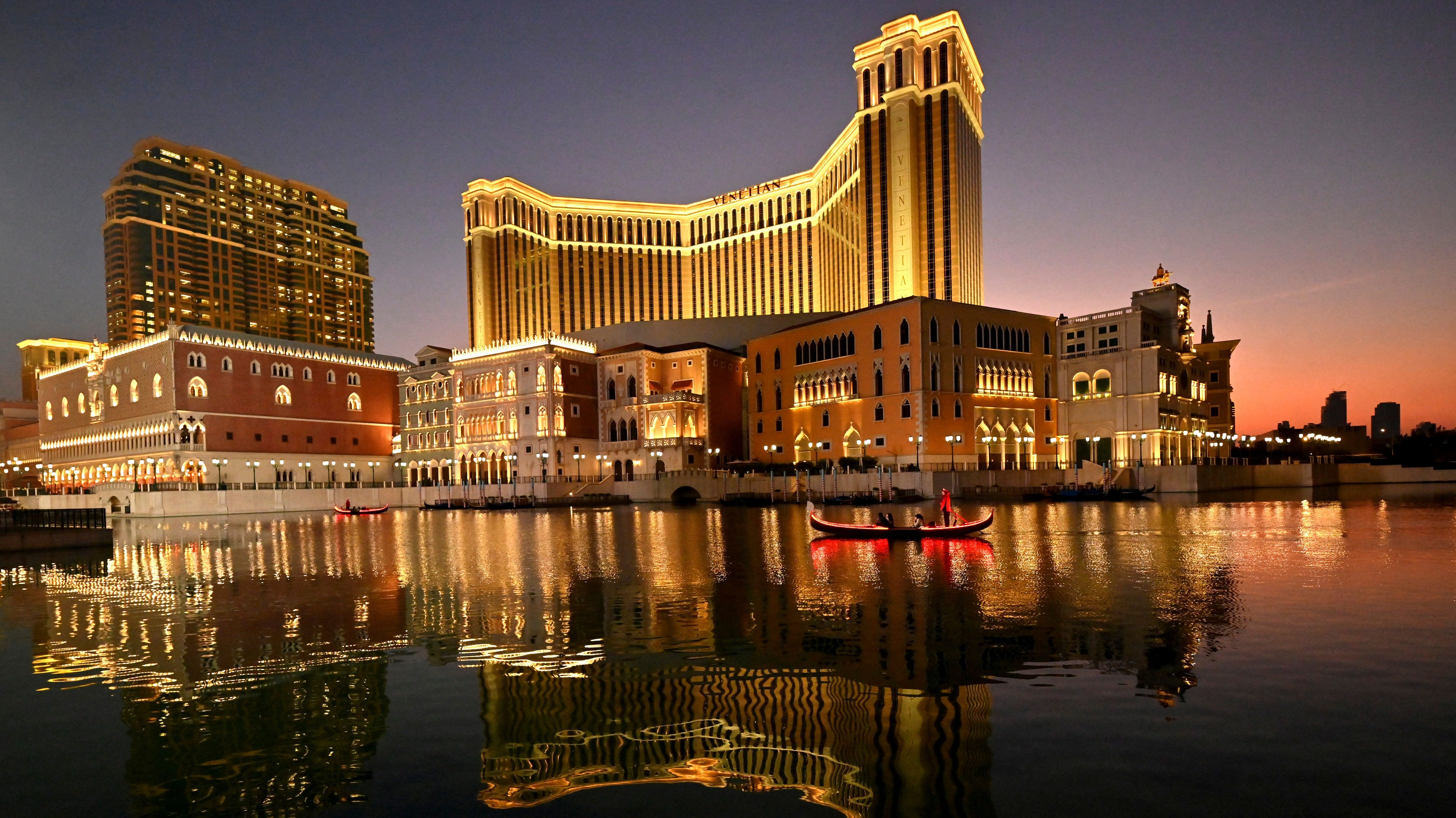 Chinese tourists ride a gondola at the Venetian Casino complex in Macau in January 2023.