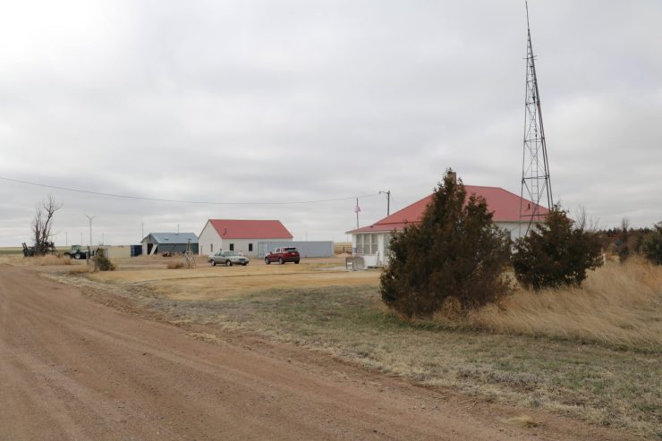 A group of wind turbines generate renewable energy behind a farm in Peetz, Colorado, in March