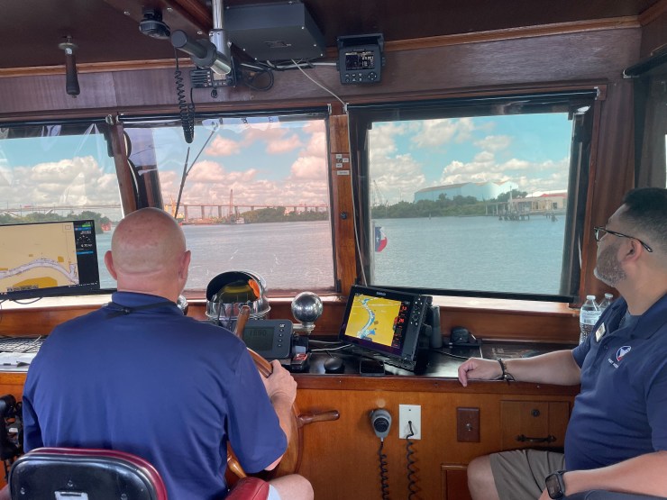 Sam Houston tour boat captains Genaro Ambriz and Greg Penton navigate a vessel through the Houston Ship Channel.