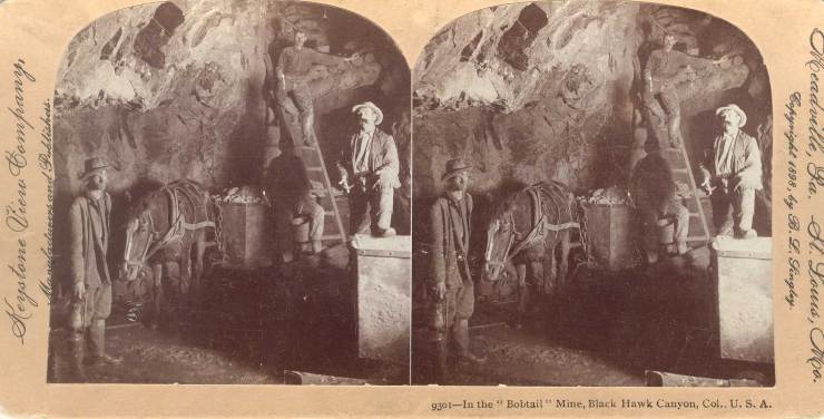 A historic photograph of miners in a mine.